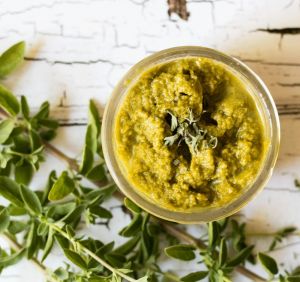 bowl full of oregano pesto and freshly picked sprigs of oregano 