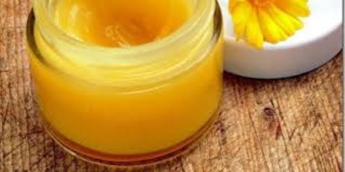 Calendula salve with the yellow- orange  calendula flower