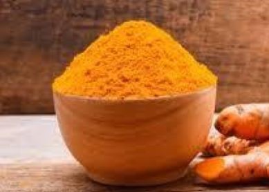 A bowl of orange turmeric just waiting to be added to a curry dish and which will help with inflammation.